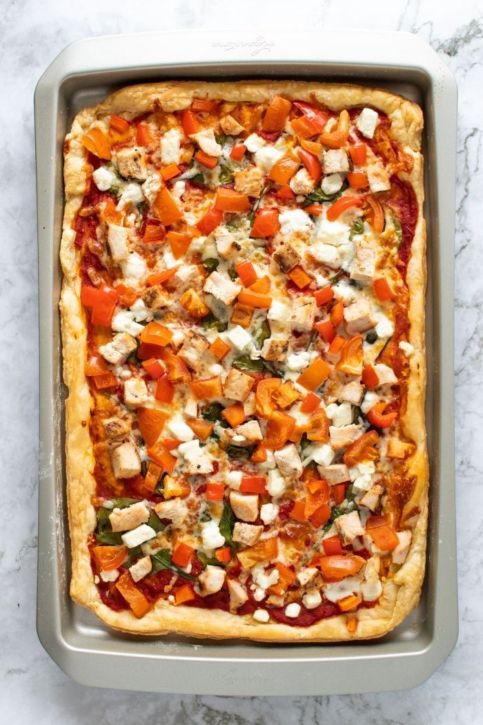 the finished puff pastry pizza is shown in the baking sheet
